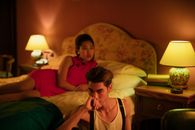 Woman in Red Dress Lying on Bed