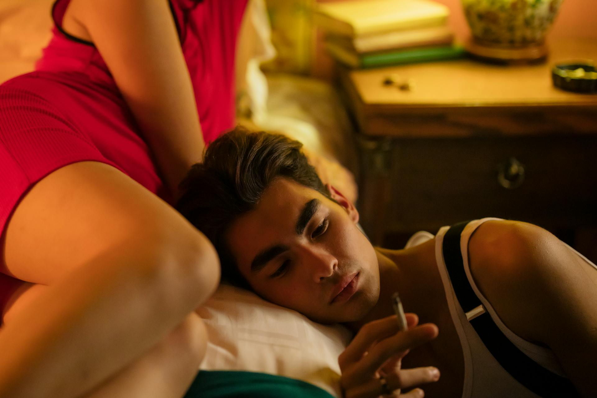 Man Resting His Head on the Bed