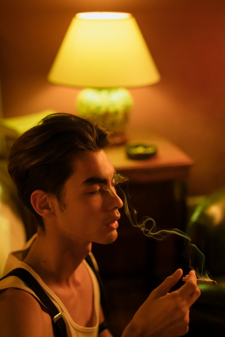 Man Smoking Inside The Room