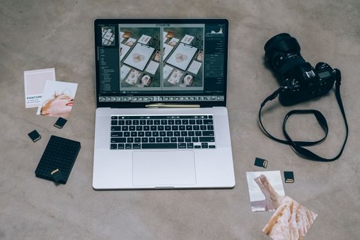 Macbook Pro Beside Black Headphones