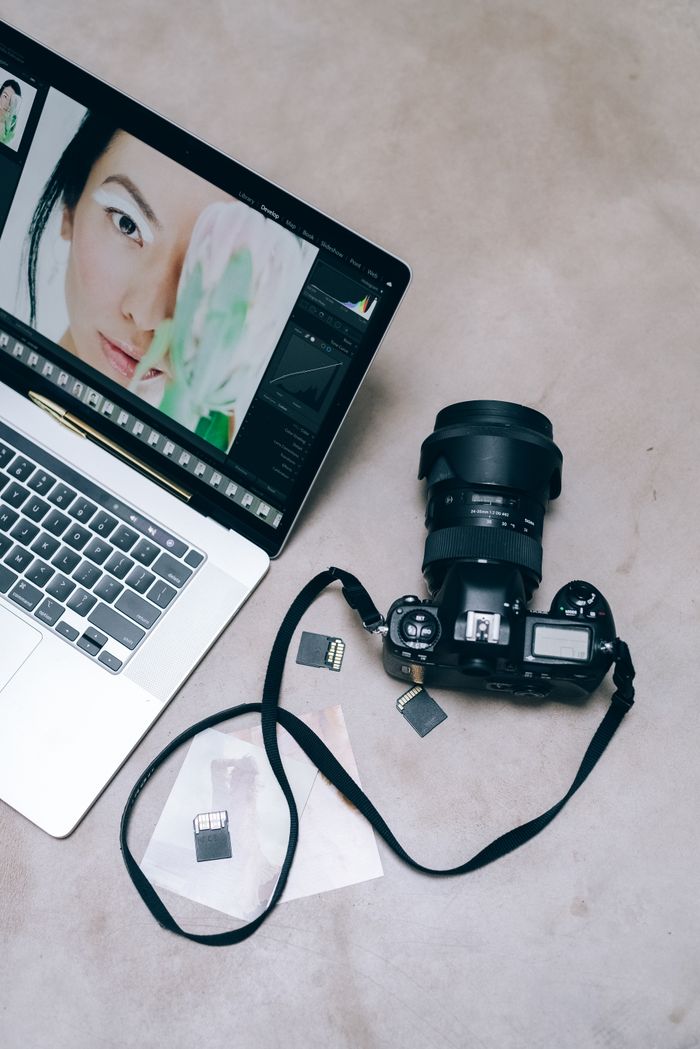 DSLR camera and laptop set up for advanced video editing and color grading