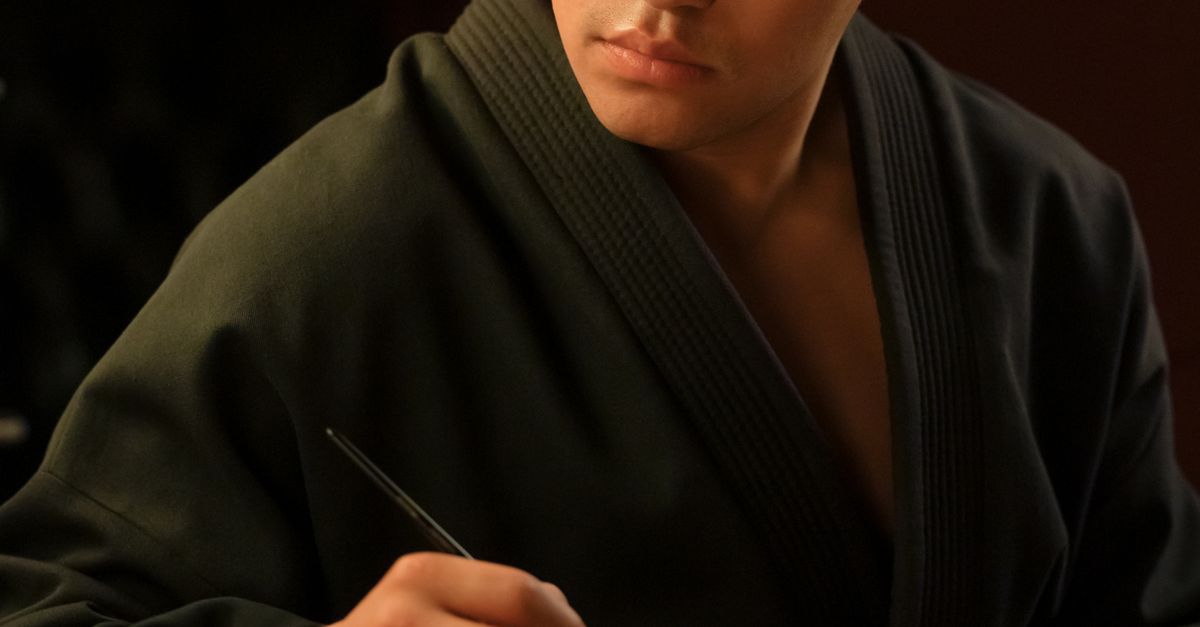 Man In Dark Robe Man in Black Robe Holding a Paintbrush · Free Stock Photo