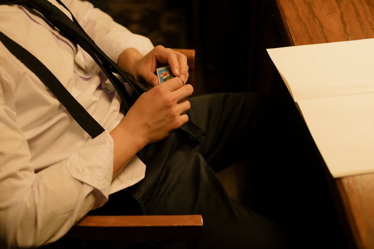 Man Holding A Matchbox