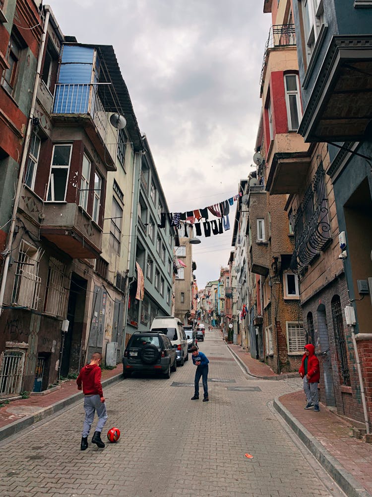 Kids Playing Soccer In The Street