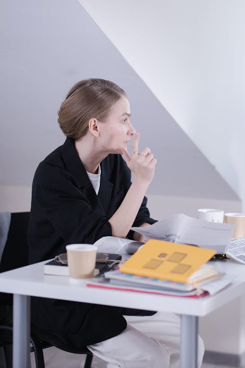 A Woman Sitting at the Desk