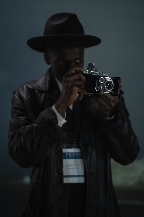 A Man Using Camera 