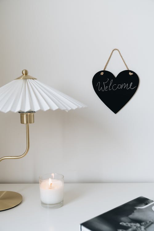 Free Candle Burning Beside a Lamp Stock Photo
