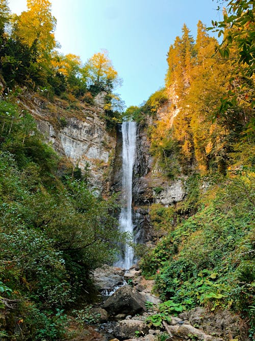 Waterfalls Between Green Trees Under Blue Sky