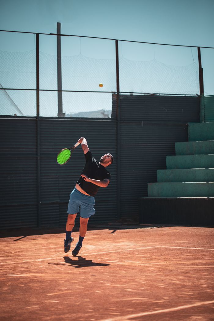Tennis player serving