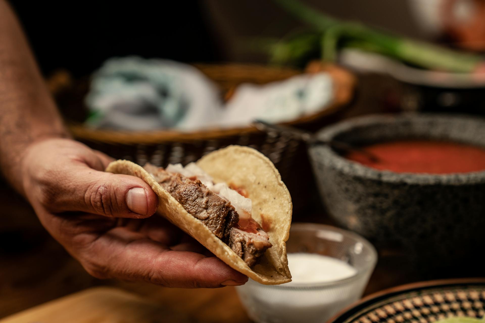 A Person Holding a Taco