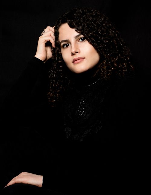 Portrait of Woman with Curly Hair in Black and White · Free Stock Photo