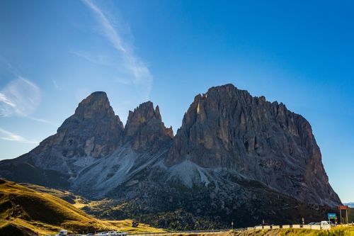 Free Picturesque landscape of massive rough rocky Dolomite Mountains located in Italy against cloudless blue sky in sunny sunny day Stock Photo