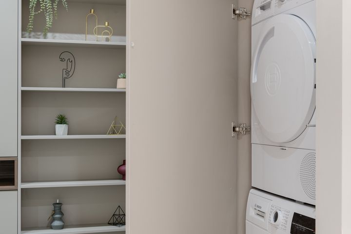 240V dryer outlet installation in Orem Washing machine and dryer installed in a cabinet laundry space