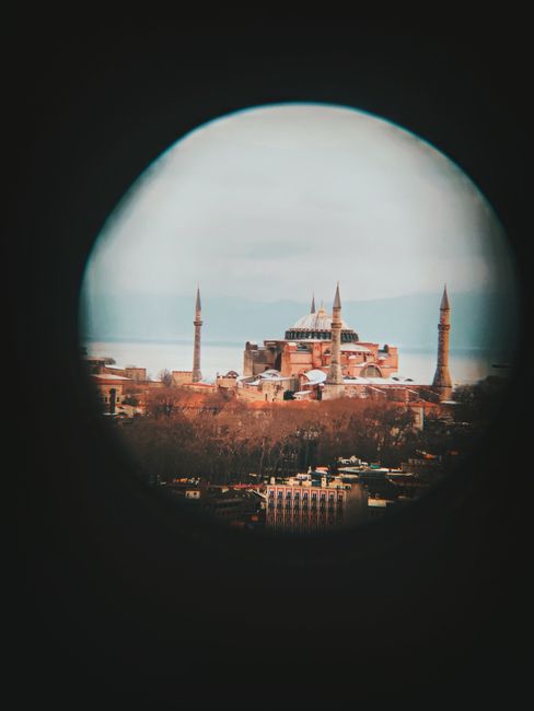 View of Hagia Sophia through a circular lens, highlighting its architectural beauty in Istanbul.