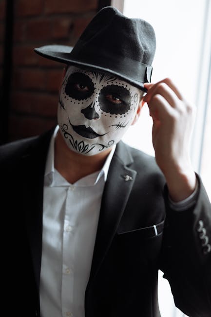 Man in Black Suit Jacket Wearing Black and White Mask · Free Stock Photo