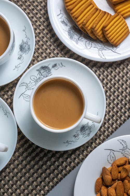 Free Close-Up Shot of a Cup of Coffee on a Saucer Stock Photo