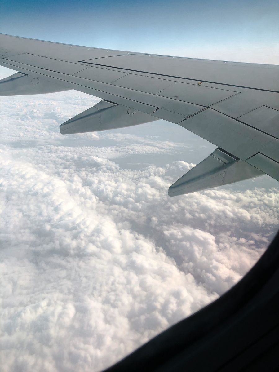 Airplane flying above the clouds
