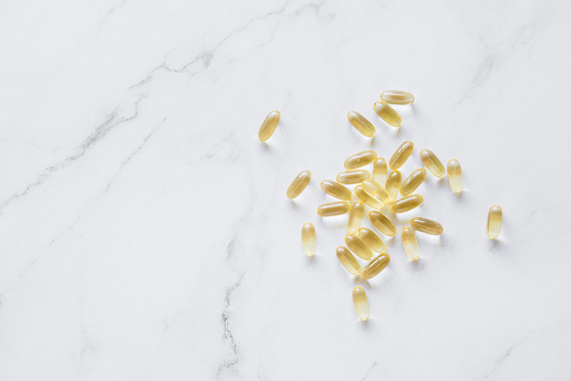 Fish Oil Capsules on Marble Surface