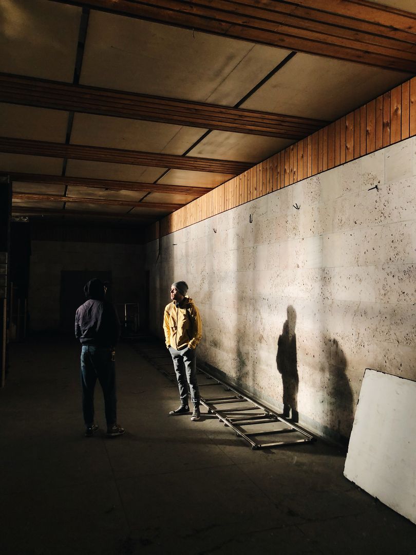 Quiet conversation in shadows