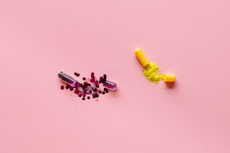 Medicine Capsules On Pink Background