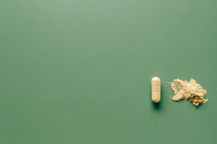 Medication Pill On Green Background