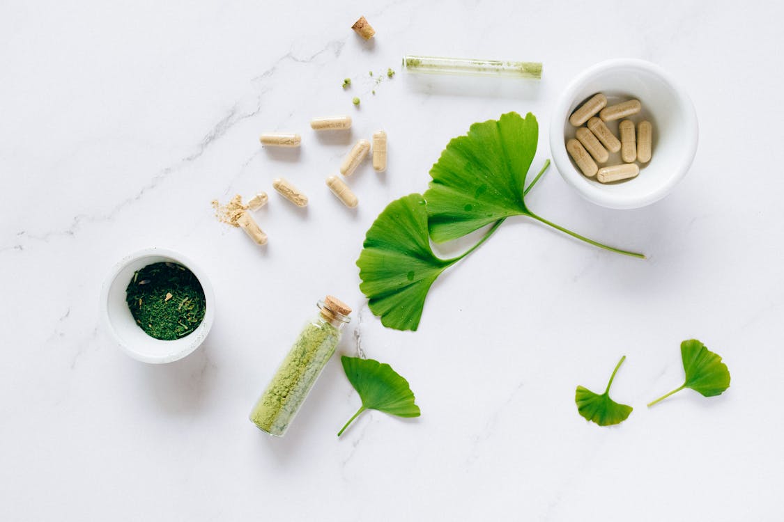 Free Ginkgo Leaves and Glass Containers with Powder Stock Photo