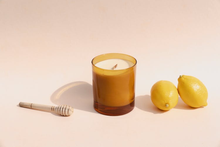 Lemons Near A Candle In A Jar