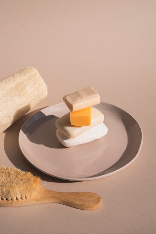 Free Bar Soaps on a Ceramic Plate Stock Photo