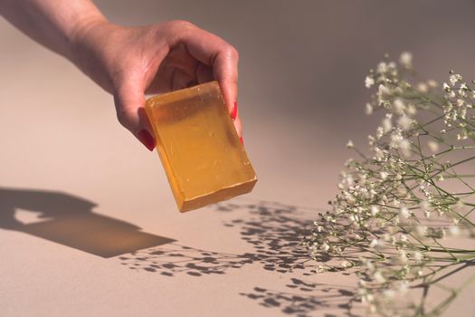Person Holding Yellow Glass Cup