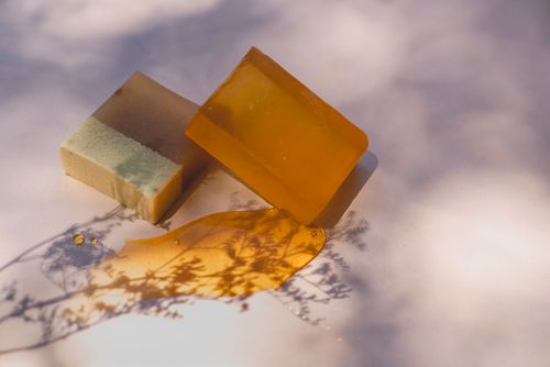 Free Close-up of handmade soap bars under artistic lighting, showcasing natural ingredients and shadows. Stock Photo
