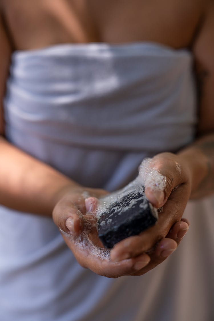 Person Holding A Bubbly Soap