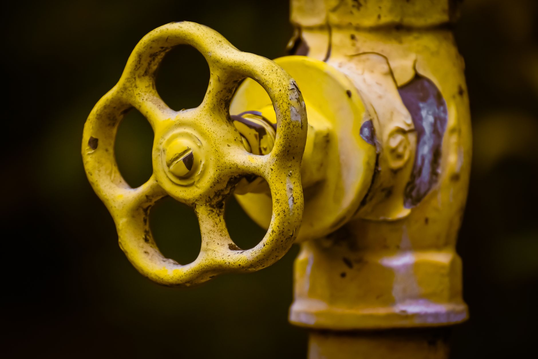 How to Replace a Shutoff Valve Using Home Depot Supplies Close-up view of a rusty yellow shut-off valve, emphasizing industrial wear.