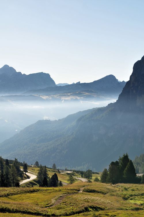 Free Stunning aerial shot of the Dolomites in Italy showcasing foggy valleys and towering peaks. Stock Photo