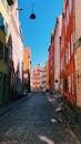 Paved Narrow Street Between Colorful Buildings