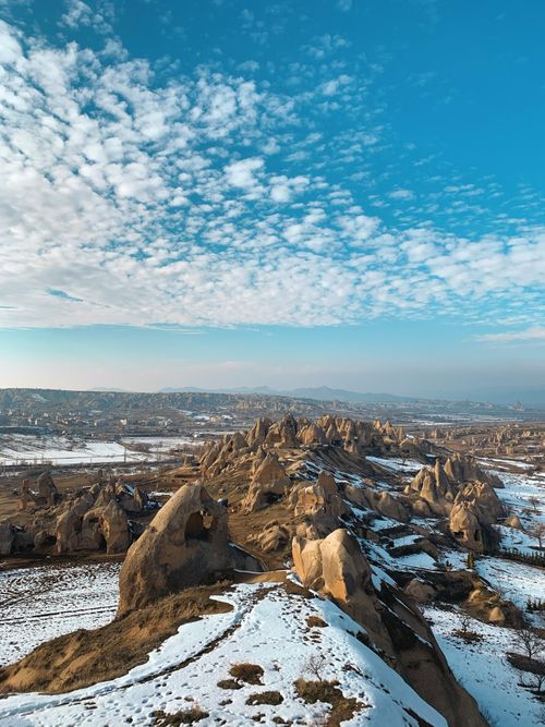 Free A breathtaking view of snow-covered rock formations in Cappadocia, Türkiye. Stock Photo