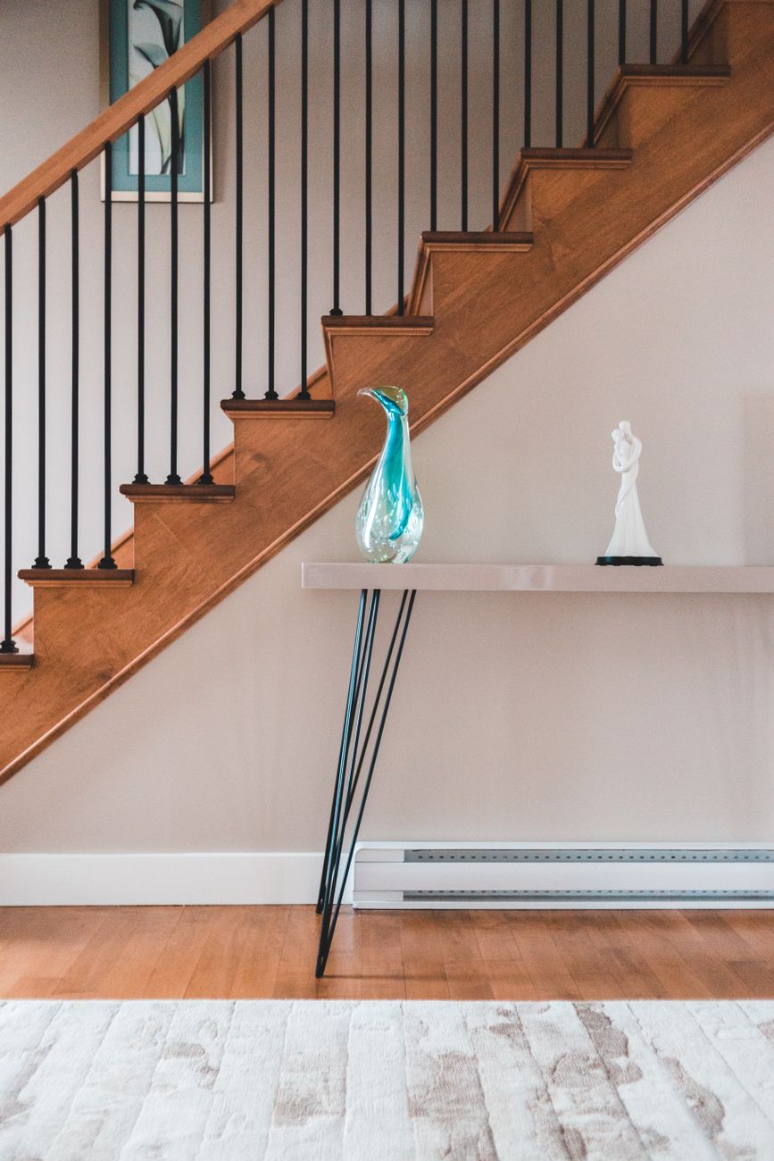 Elegant home interior featuring a modern staircase and decorative elements for stylish decor.