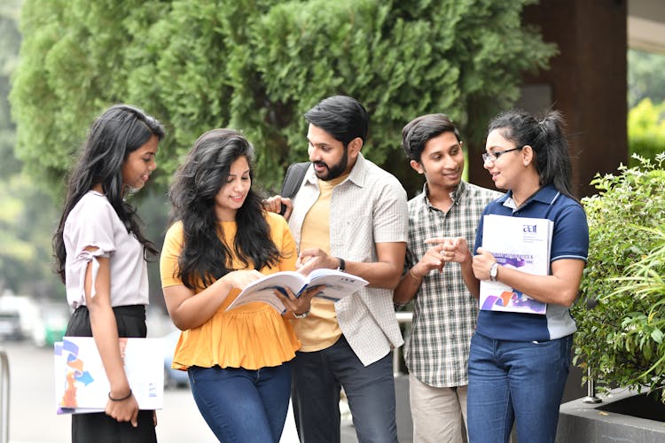 Group Students Talking In The Campus