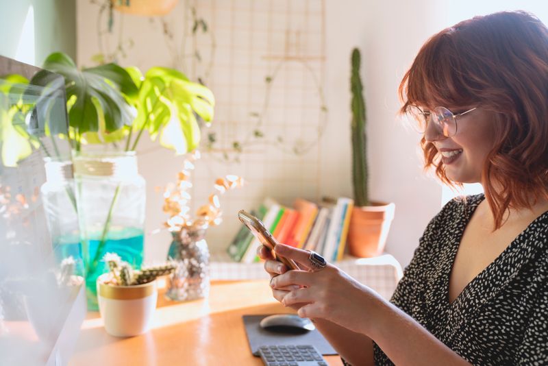 Someone using a smartphone for personal finance