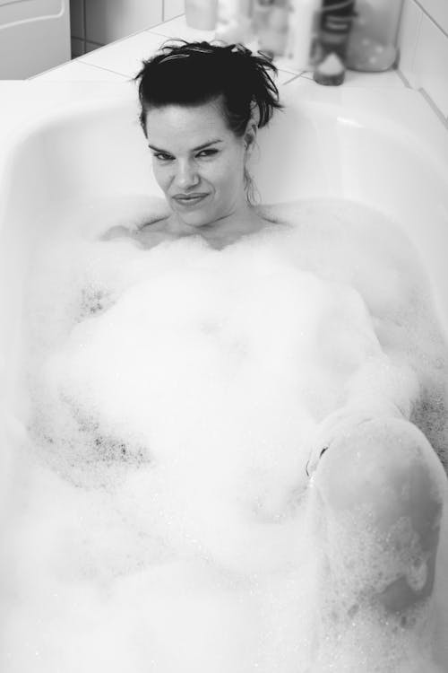 A Woman Lying on the Bathub