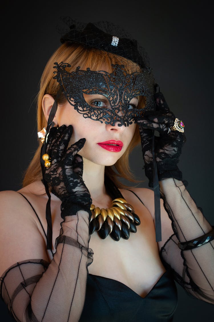 Woman Wearing Black Outfit And Carnival Mask