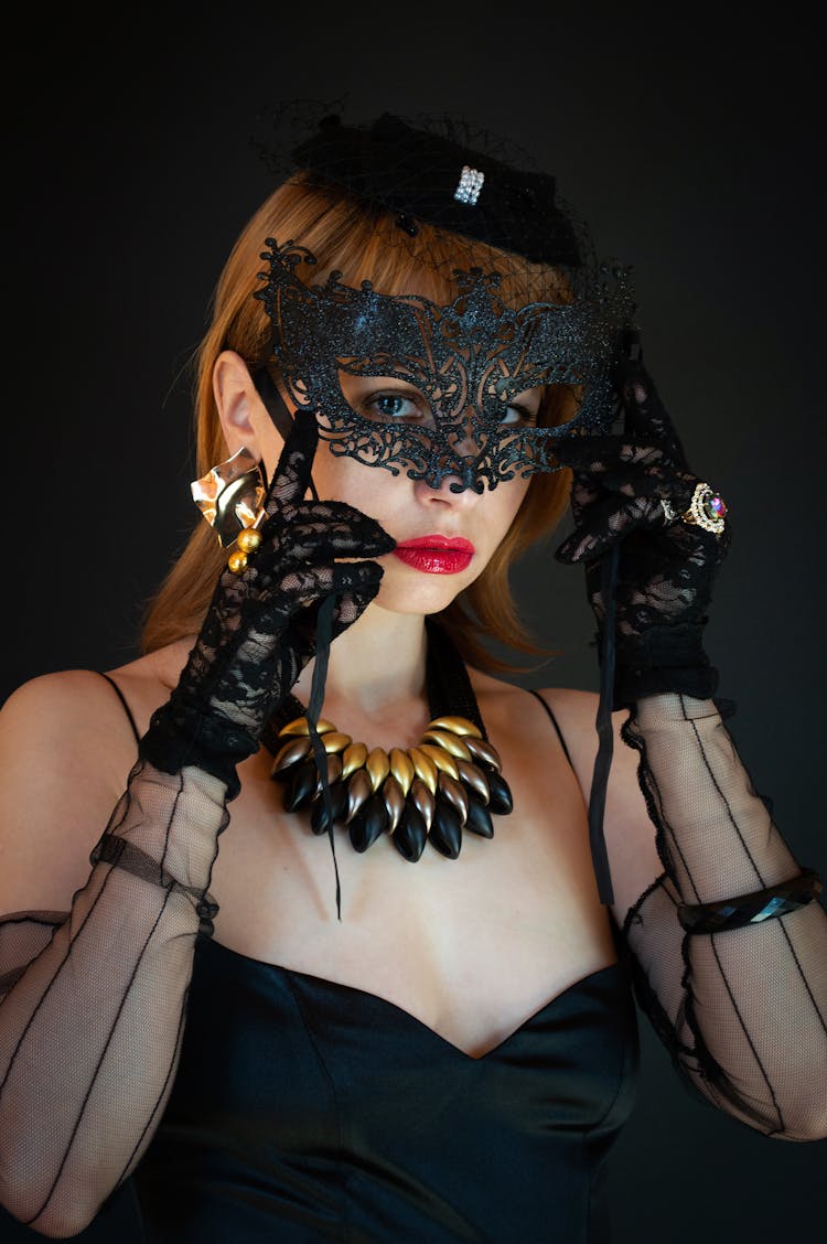 Woman In Black Carnival Costume With Mask