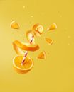 Sliced Orange Fruit on Yellow Surface