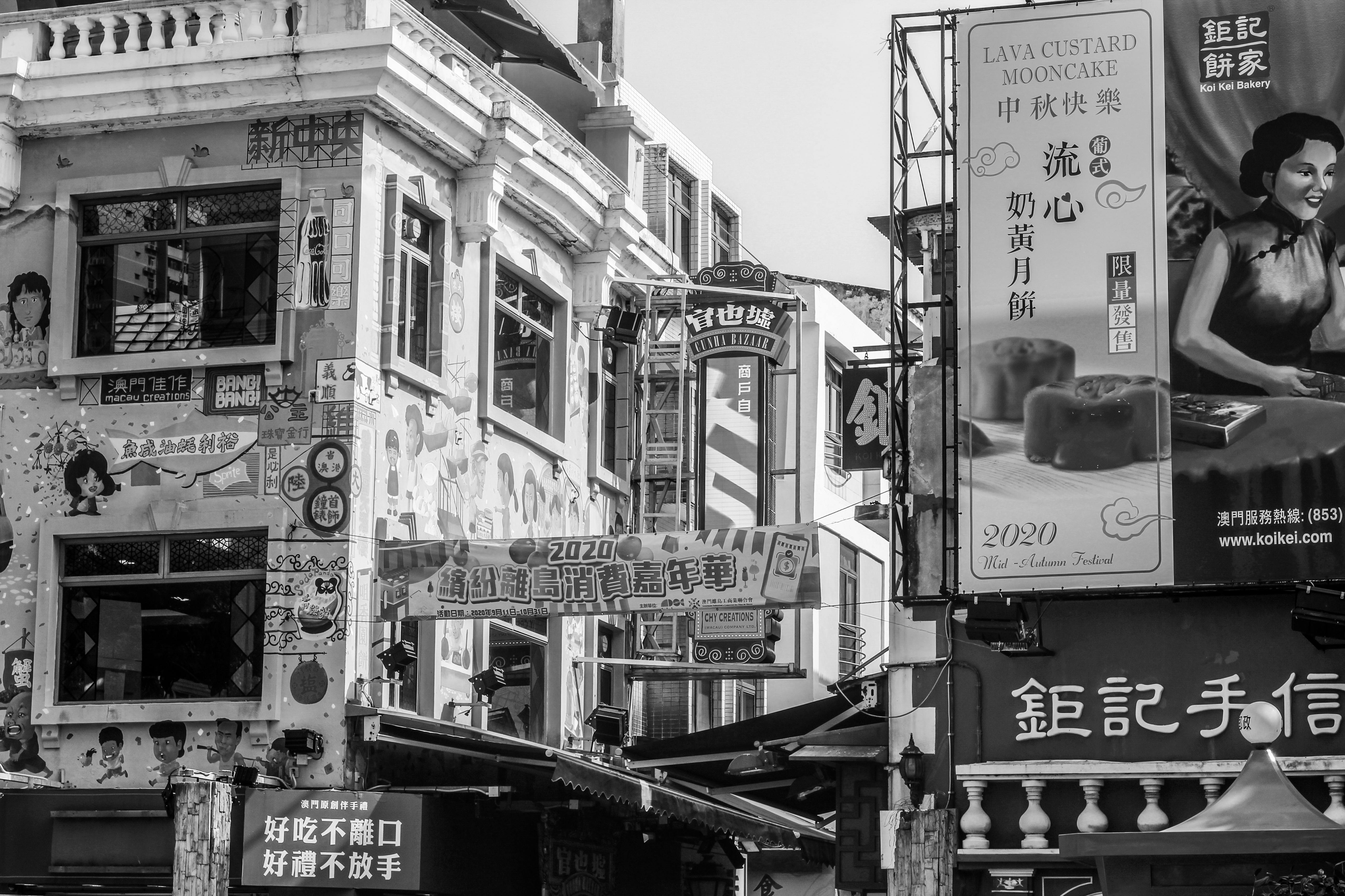 grayscale photo of city buildings