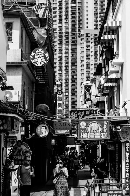 Grayscale Photo of People Walking on the Street