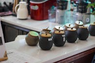 Black Round Jars on the Table
