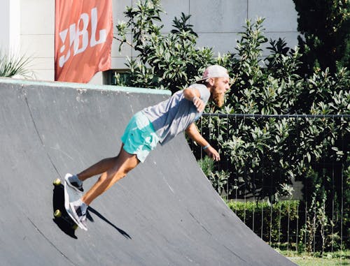 Free Man Making Stunt With Skateboard Stock Photo