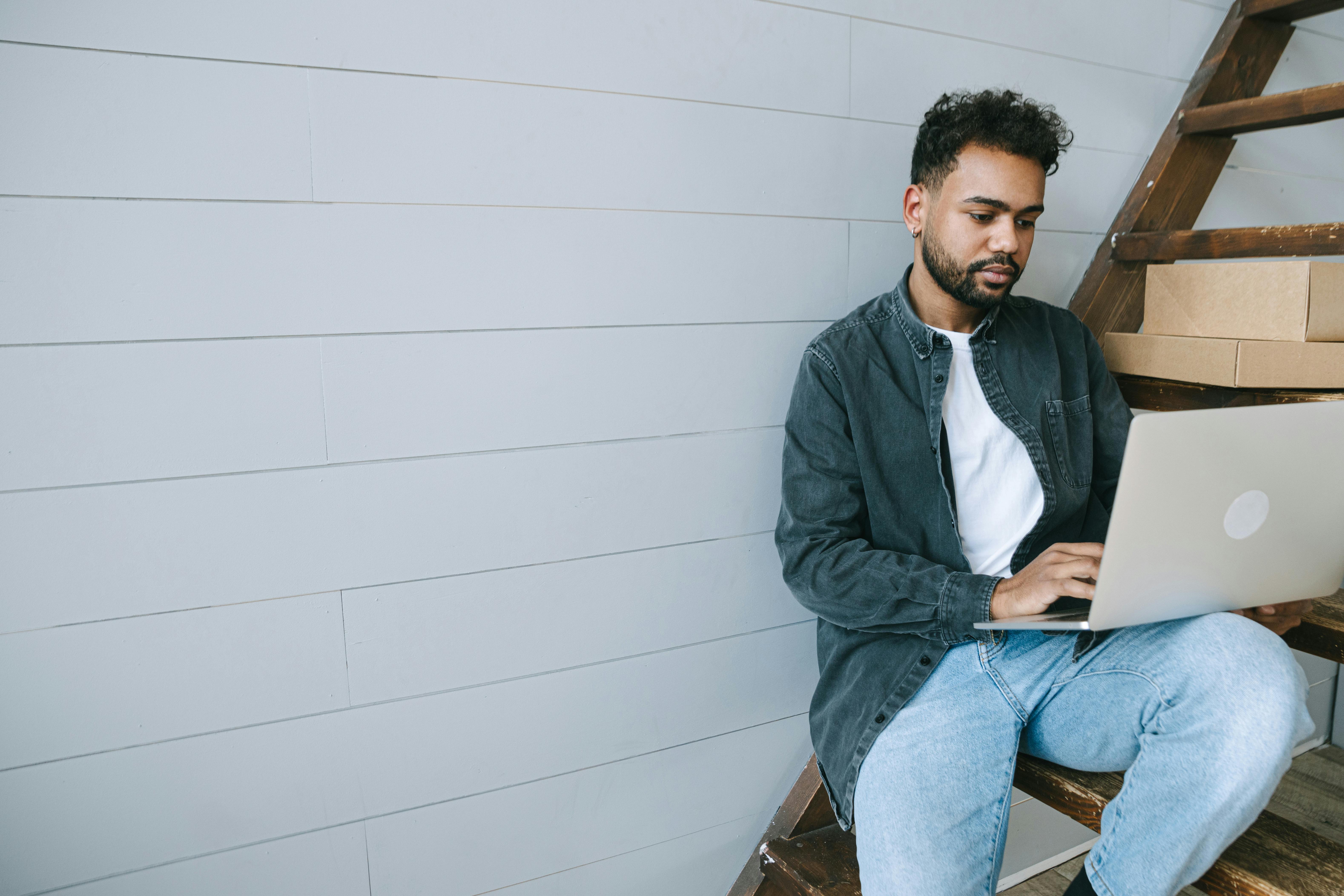 Person using Laptop on Staircase