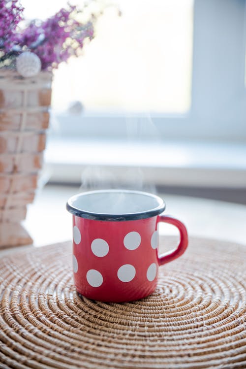 Free Red, White, and Black Ceramic Mug on Table Stock Photo