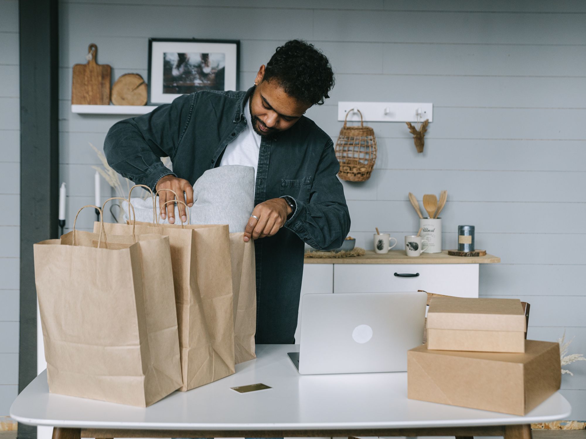 Packing Services in Walker, North East — professional packer wrapping fragile items in a box