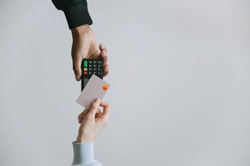 Person Holding White and Black Smartphone